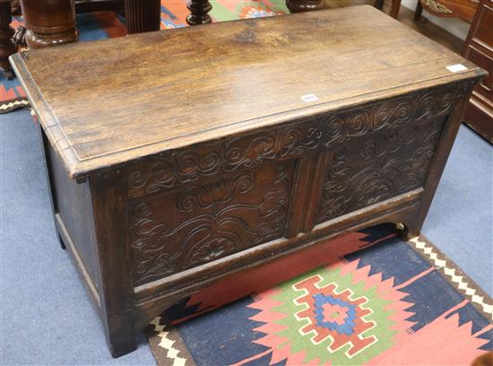 A late 19th century French carved oak coffer, W.100cm